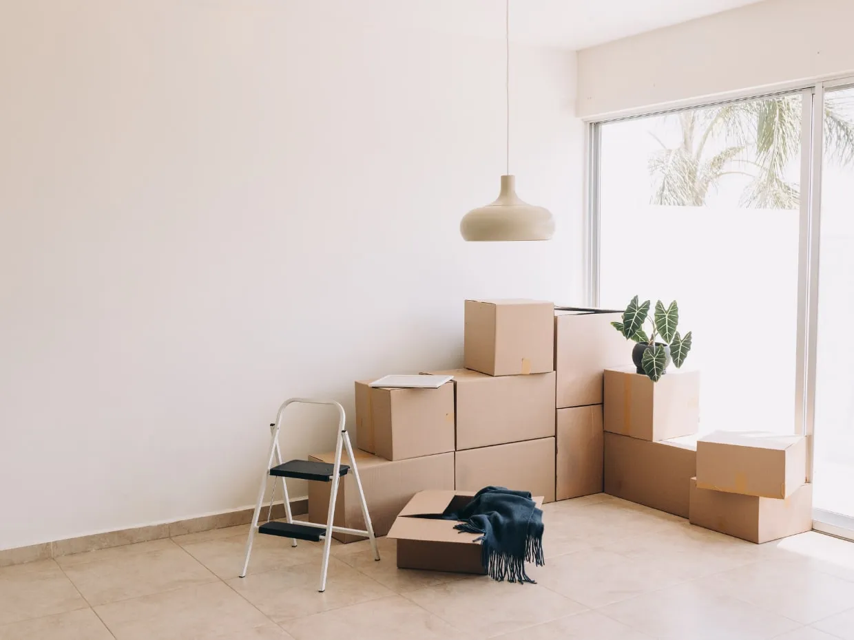 Empty, freshly cleaned room with moving boxes ready for move-in