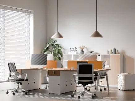 Clean, organized office workspace with desks and chairs